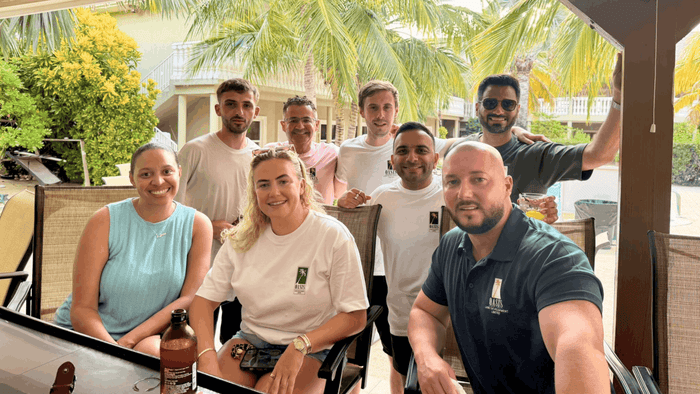 A group of friends together on a porch on Cayman Brac