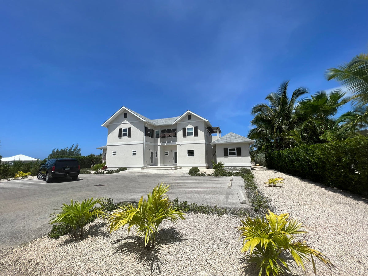 Completed Cayman Islands home with finished driveway and landscaping; an illustration of future home possibilities
