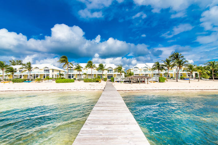 A wooden jetty leading to beachfront homes at Blossom Village, Little Cayman